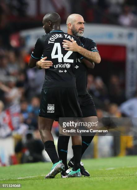 Eric Cantona of the Rest of the World replaces Yaya Toure of the Rest of the World as substitute during the Soccer Aid for UNICEF 2018 match between...