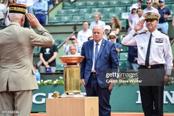 President of the French Tennis Federation Bernard Giudicelli , in the presence of the chief of the French army and the chief air marshall, supervises...