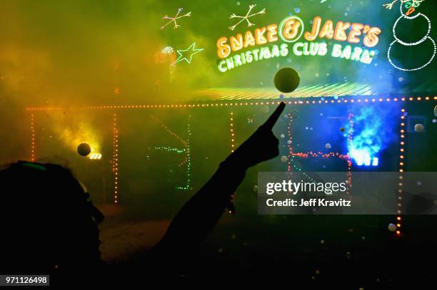 Festivalgoers are seen during 90s Rave by Full Service Party at Snake & Jake's Christmas Club Barnduring day 4 of the 2018 Bonnaroo Arts And Music...