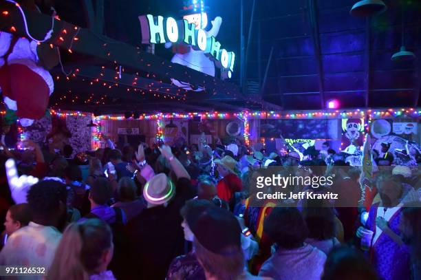 Festivalgoers are seen during 90s Rave by Full Service Party at Snake & Jake's Christmas Club Barnduring day 4 of the 2018 Bonnaroo Arts And Music...