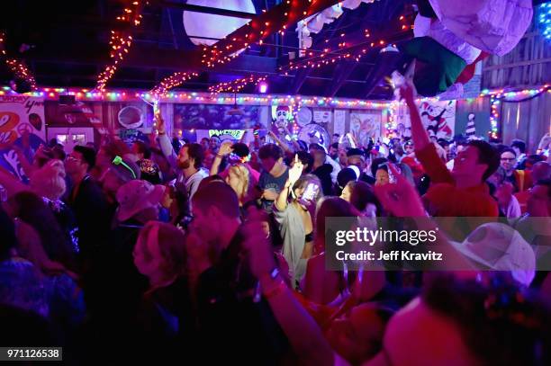 Festivalgoers are seen during 90s Rave by Full Service Party at Snake & Jake's Christmas Club Barnduring day 4 of the 2018 Bonnaroo Arts And Music...