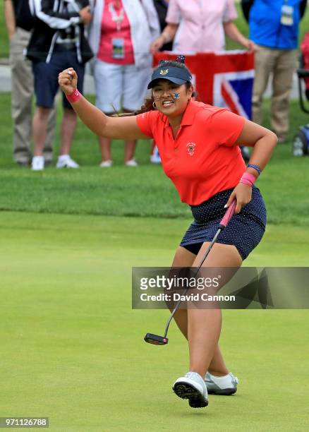 Lilia Vu of the United States team celebrates holing a birdoe putt on the 18th hole to win her match by one hole against Sophie Lamb of the Great...