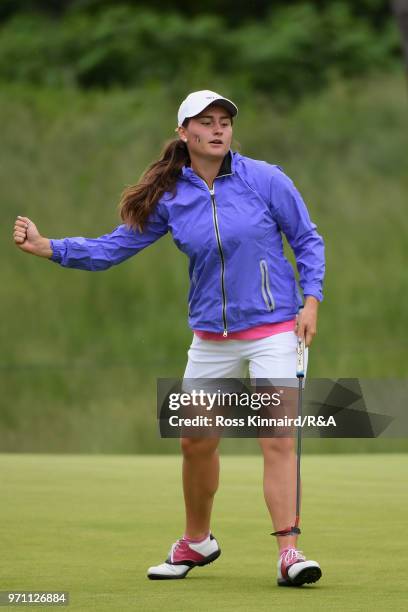 Lily May Humphreys of the Great Britain and Ireland team celebrates a birdie on the 15th hole during the singles matches on day three of the 2018...