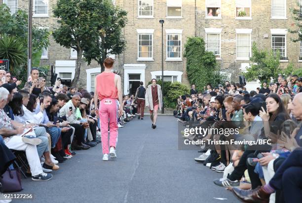 Model walks the runway at the Martine Rose show during London Fashion Week Men's June 2018 on June 10, 2018 in London, England.