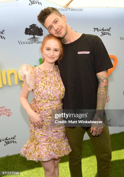 Madelaine Petsch and Travis Mills attend Children Mending Hearts' 10th Annual Empathy Rocks on June 10, 2018 in Los Angeles, California.