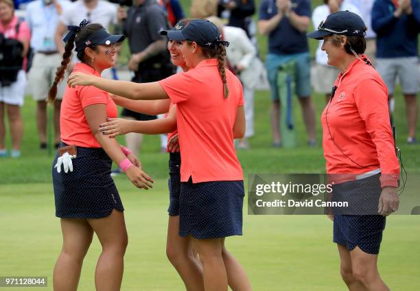 Lilia Vu of the United States team is congratulated by team players Kristen Gillman and Andrea Lee as captain Virginia Derby Grimes watches on the...