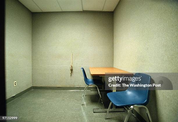 View of a typical interrogation room at the Prince George's County Police HQ's in Landover. In center of the back wall are the handcuff rings.