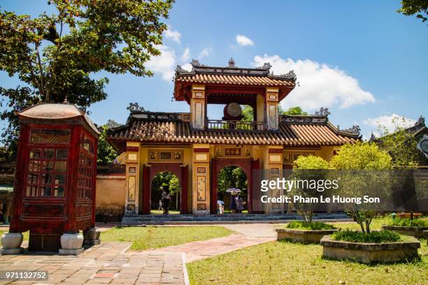 ancient gate with watchtower in citadel of hue - heritage hall stock pictures, royalty-free photos & images