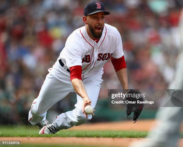 Matt Barnes of the Boston Red Sox throws to first base at the top of the ninth inning of the game against the Chicago White Sox at Fenway Park on...