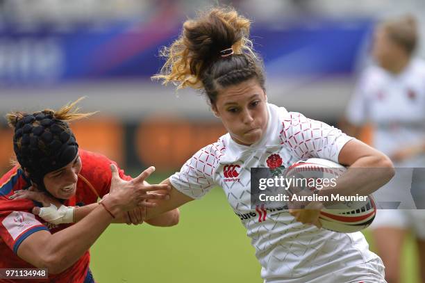 Abbie Brown of England is tackled during the match between England and Spain at the HSBC Paris Sevens, stage of the Rugby Sevens World Series at...