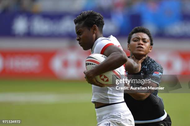 Naya Tapper of The United States Of America is tackled by Viniana Riwai of Fiji during the match between The United States Of America and Fiji at the...