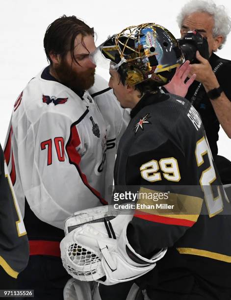 Goaltenders Braden Holtby of the Washington Capitals and Marc-Andre Fleury of the Vegas Golden Knights shake hands on the ice after Game Five of the...