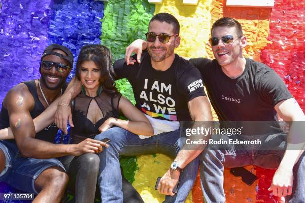 Cast members Toby Onwumere, Tina Desai, Miguel Angel Silvestre, and Brian Smith pose for portrait on top of Sense8 float at LA Pride Music Festival...