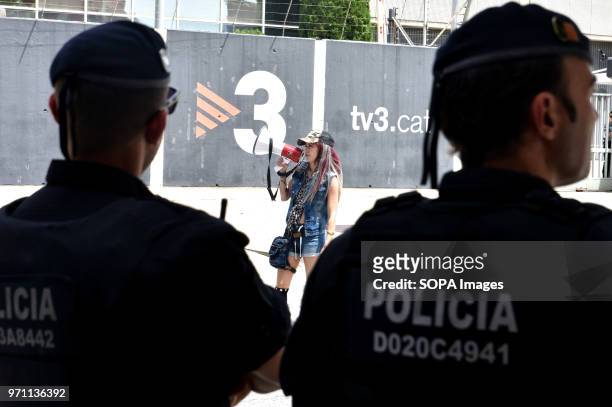 Two police officers watch a demonstrator of the right-wing groups during the protest. Hundreds of people, fans and groups of the ultra right like...