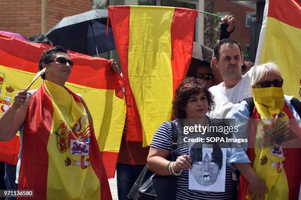 Group of protesters with flags of Spain in front of the headquarters of the Public Television of Catalonia. Hundreds of people, fans and groups of...