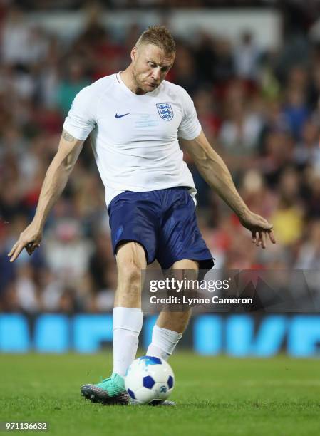 Andrew Flintoff of England scores a penalty in the shoot out during the Soccer Aid for UNICEF 2018 match between Englannd and the Rest of the World...