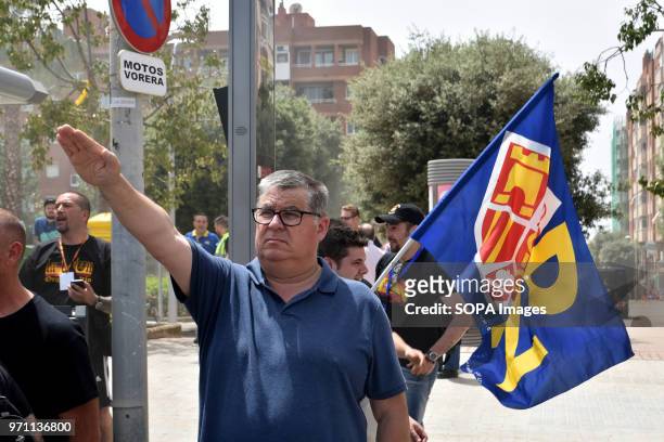 Protester of the groups of the ultra right makes the fascist salute while the anthem of Spain is playing during the demonstration. Hundreds of...