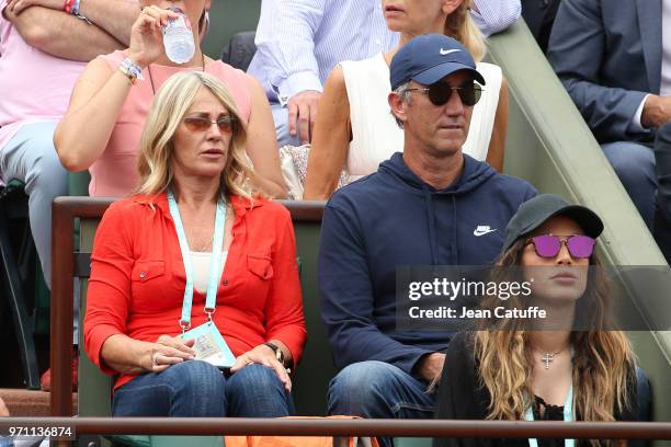 Nadia Comaneci, Darren Cahill, coach of Simona Halep of Romania during the men's final on Day 15 of the 2018 French Open at Roland Garros stadium on...