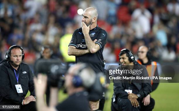 World XI's Eric Cantona appears dejected after the final whistle during the UNICEF Soccer Aid match at Old Trafford, Manchester. PRESS ASSOCIATION...