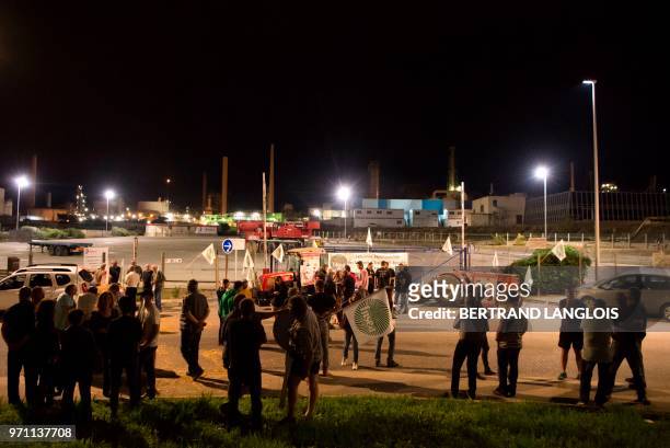 French National federation of Agricultural Holders' Unions and Young Farmers union members demonstrate as they block the access of French oil giant...