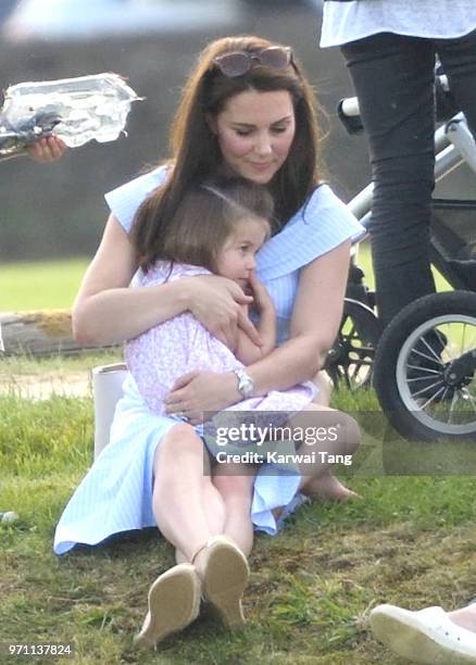 Catherine, Duchess of Cambridge and Princess Charlotte of Cambridge attend the Maserati Royal Charity Polo Trophy at Beaufort Park on June 10, 2018...