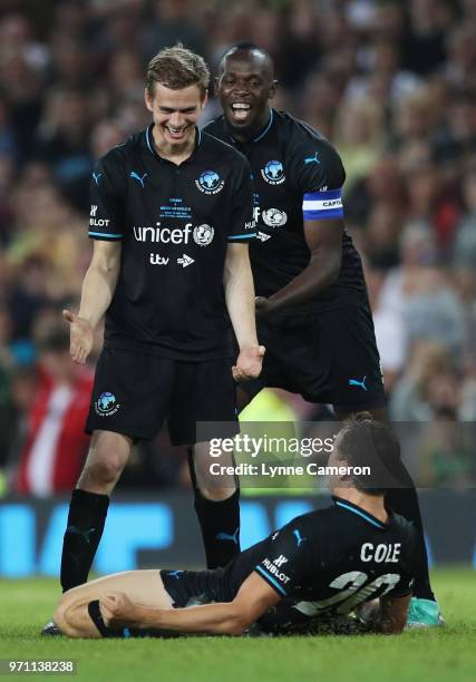 Brendan Cole of the Rest of the World celebrates as he scores a penalty in the shoot out with Hayden Christensen and Usain Bolt of the Rest of the...