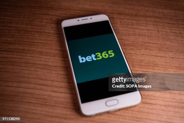In this photo illustration, the British online gambling and casino games company, Bet365, logo is displayed on a smartphone.