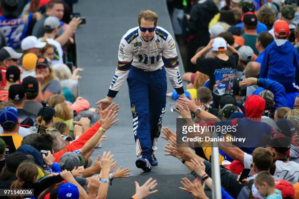 Brad Keselowski, driver of the Miller Lite Ford, is introduced prior to the Monster Energy NASCAR Cup Series FireKeepers Casino 400 at Michigan...