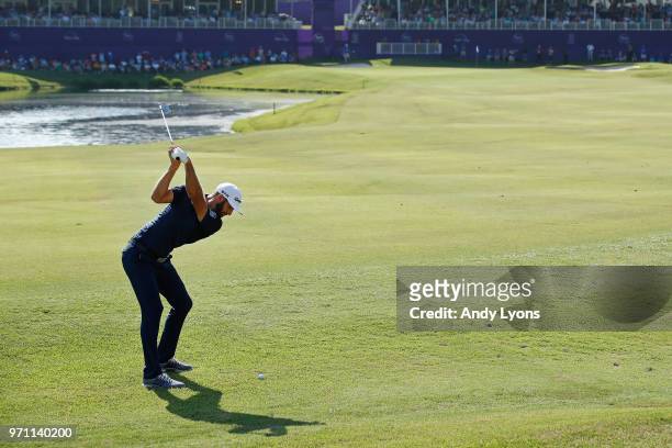 Dustin Johnson hits his second shot for eagle on the 18th hole during the final round of the FedEx St. Jude Classic at TPC Southwind on June 10, 2018...