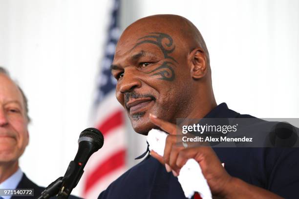 Mike Tyson speaks during the parade of champions at the International Boxing Hall of Fame for the Weekend of Champions induction event on June 10,...