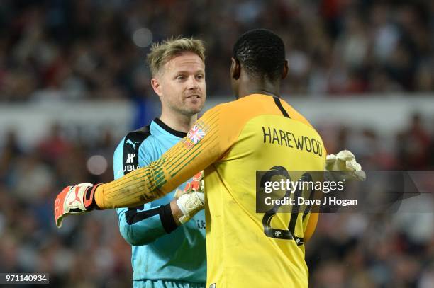 David Harewood speaks with Nicky Byrne during Soccer Aid for Unicef 2018 at Old Trafford on June 10, 2018 in Manchester, England.