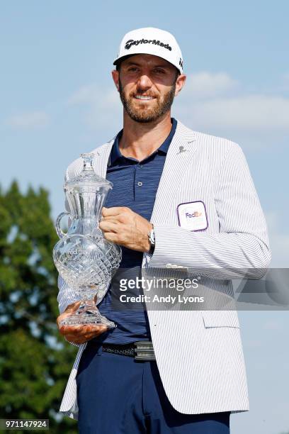 Dustin Johnson poses with the trophy after the final round of the FedEx St. Jude Classic at TPC Southwind on June 10, 2018 in Memphis, Tennessee.
