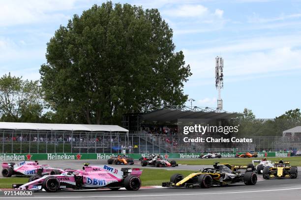 Esteban Ocon of France driving the Sahara Force India F1 Team VJM11 Mercedes leads Nico Hulkenberg of Germany driving the Renault Sport Formula One...