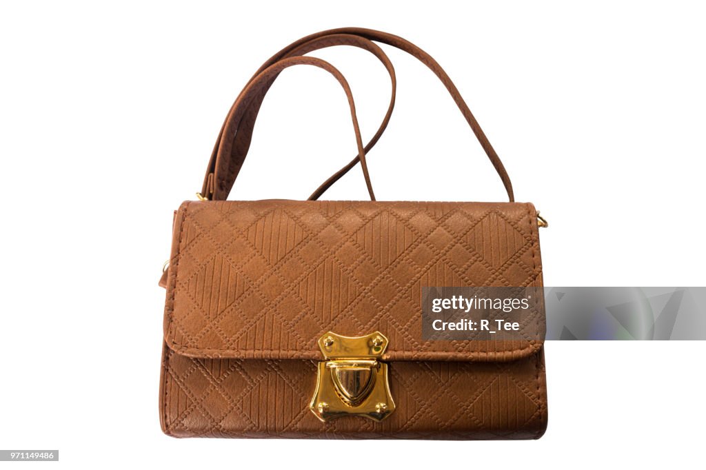 Close-Up Of Brown Purse Over White Background