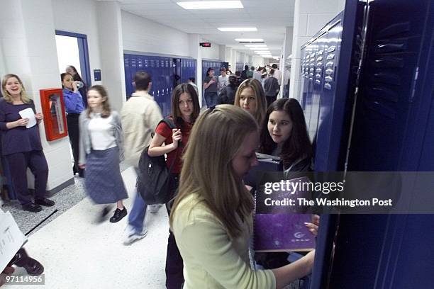 Photos of the eighth grade class at Harper Park Middle School, which, because of crowding, is stationed at Stone Bridge High School. Period change at...