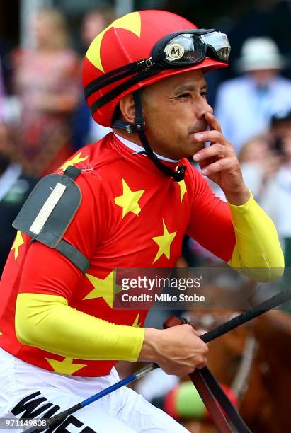 Jockey Mike Smith celebrates atop of Justify during the 150th running of the Belmont Stakes at Belmont Park on June 9, 2018 in Elmont, New York....
