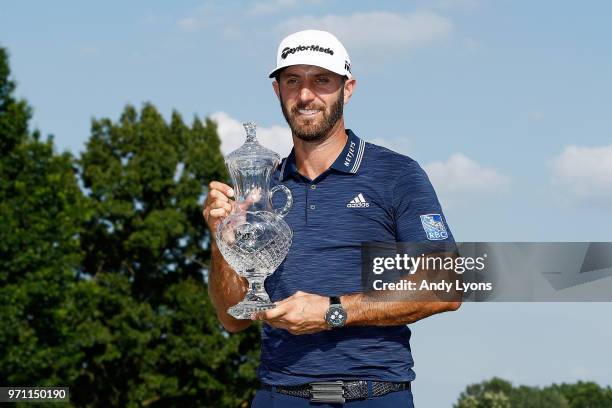 Dustin Johnson poses with the trophy after the final round of the FedEx St. Jude Classic at TPC Southwind on June 10, 2018 in Memphis, Tennessee.