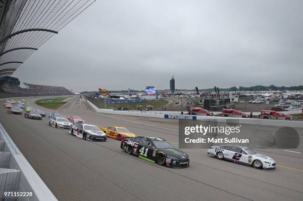 Kurt Busch, driver of the Monster Energy/Haas Automation Ford, and Brad Keselowski, driver of the Miller Lite Ford, lead the field to start the...