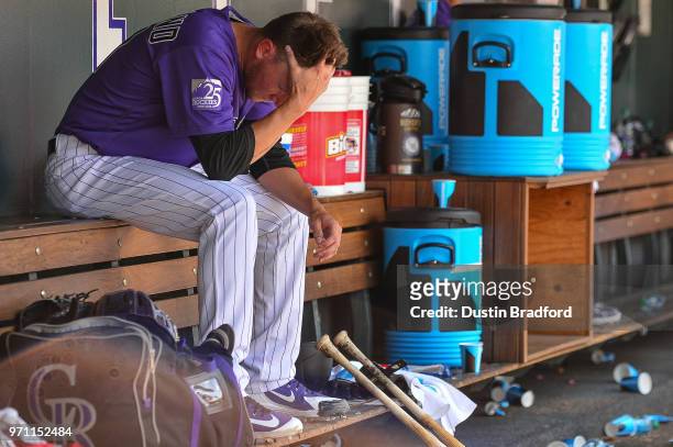 Kyle Freeland of the Colorado Rockies hangs his head in the dugout after allowing three runs to the Arizona Diamondbacks in the sixth inning of a...