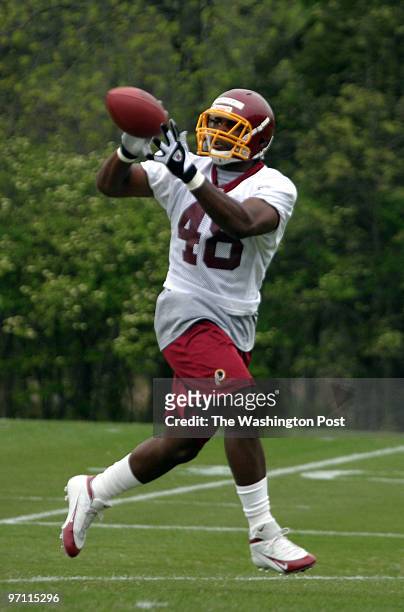 Jahi chikwendiu Manuel White, a halfback from UCLA, pulls in a pass during the Washington Redskins Rookie Camp at Redskins Park in Ashburn, VA.