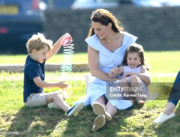 Princess Charlotte of Cambridge, Catherine, Duchess of Cambridge and Prince George of Cambridge attend the Maserati Royal Charity Polo Trophy at...