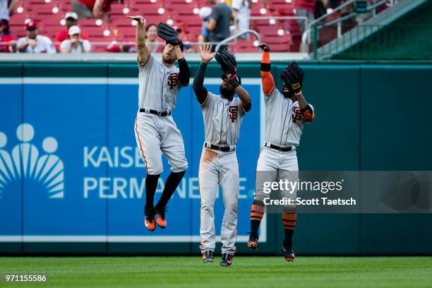 Austin Jackson, Hunter Pence, and Andrew McCutchen of the San Francisco Giants celebrate after the game against the Washington Nationals at Nationals...