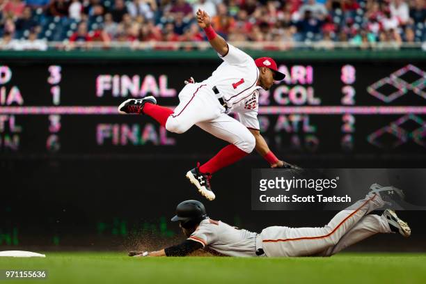 Wilmer Difo of the Washington Nationals is unable to retire Mac Williamson of the San Francisco Giants during the seventh inning at Nationals Park on...