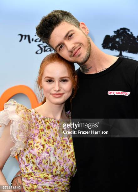 Madelaine Petsch and Travis Mills attend the 10th Annual Empathy Rocks Fundraiser at Private Residence on June 10, 2018 in Bel Air, California.