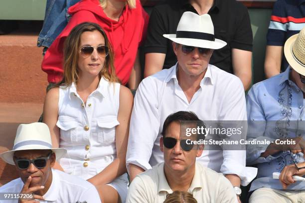 Actor Hugh Grant and his wife Anna Elisabet Eberstein attend the Men Final of the 2018 French Open - Day Fifteen at Roland Garros on June 10, 2018 in...