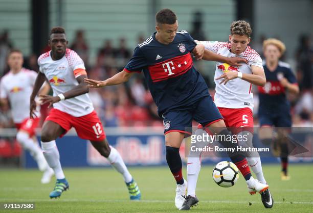 Oliver Batista Meier of FC Bayern Muenchen U17 and Mike Grimm of RB Leipzig U17 vie during the B Juniors German Championship Semi Final Second Leg...