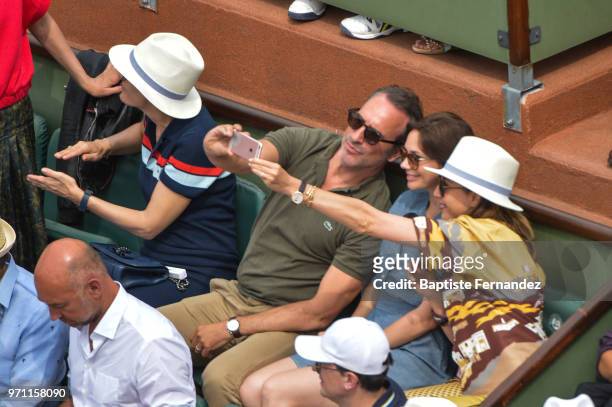 French actor Jean Dujardin take a selfie with his wife Nathalie Pechalat during Day 15 for the French Open 2018 on June 10, 2018 in Paris, France.