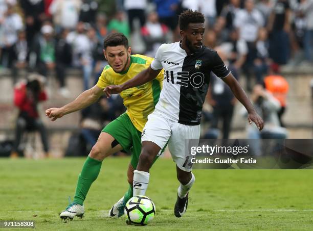 Farense midfielder Fabricio Isidoro from Brazil with CD Mafra midfielder Lucas Morelatto from Brazil in action during the Campeonato de Portugal...