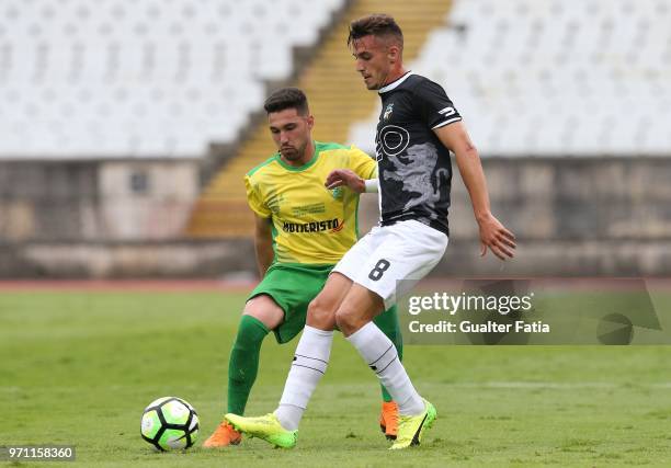 Farense midfielder Andre Vieira from Portugal with CD Mafra defender Guilherme Ferreira from Portugal in action during the Campeonato de Portugal...