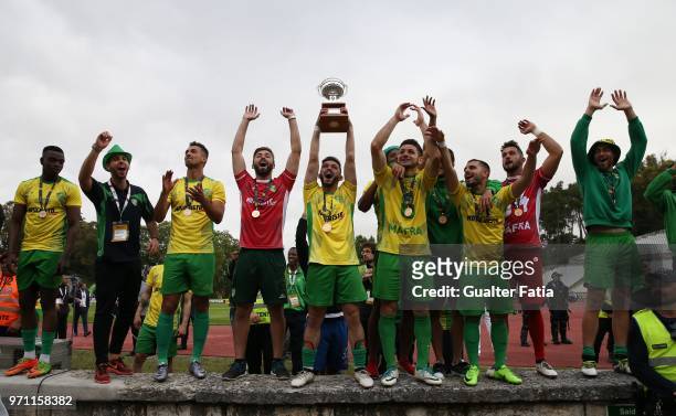 Mafra players and staff members celebrate with trophy after winning the Campeonato de Portugal Final at the end of the Campeonato de Portugal Final...